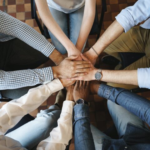 top-view-of-diverse-people-hands-holding-together-in-circle-hands-stack